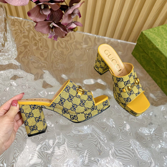 HORSEBIT SLIDE SANDAL IN TUSCANY YELLOW MONOGRAM CANVAS AND SHEEPSKIN LINING