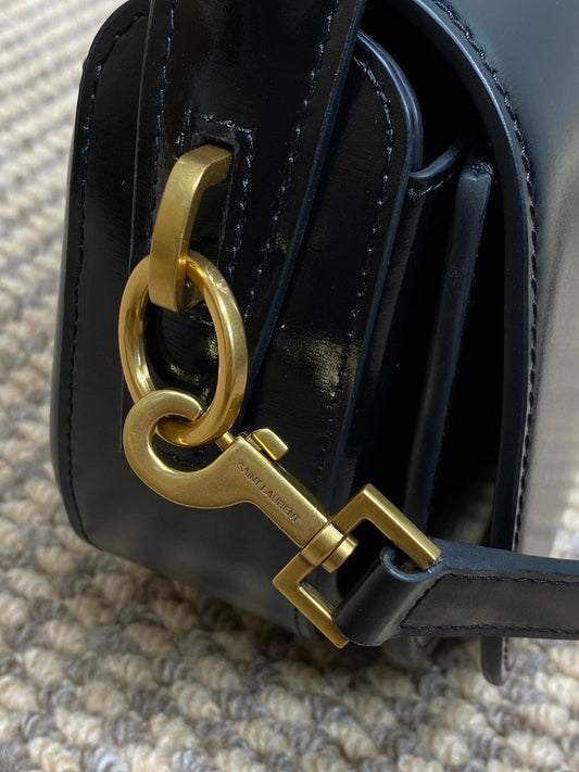 VOLTAIRE HALF-MOON SHOULDER BAG 24 IN BLACK CALFSKIN GOLD METALLIC