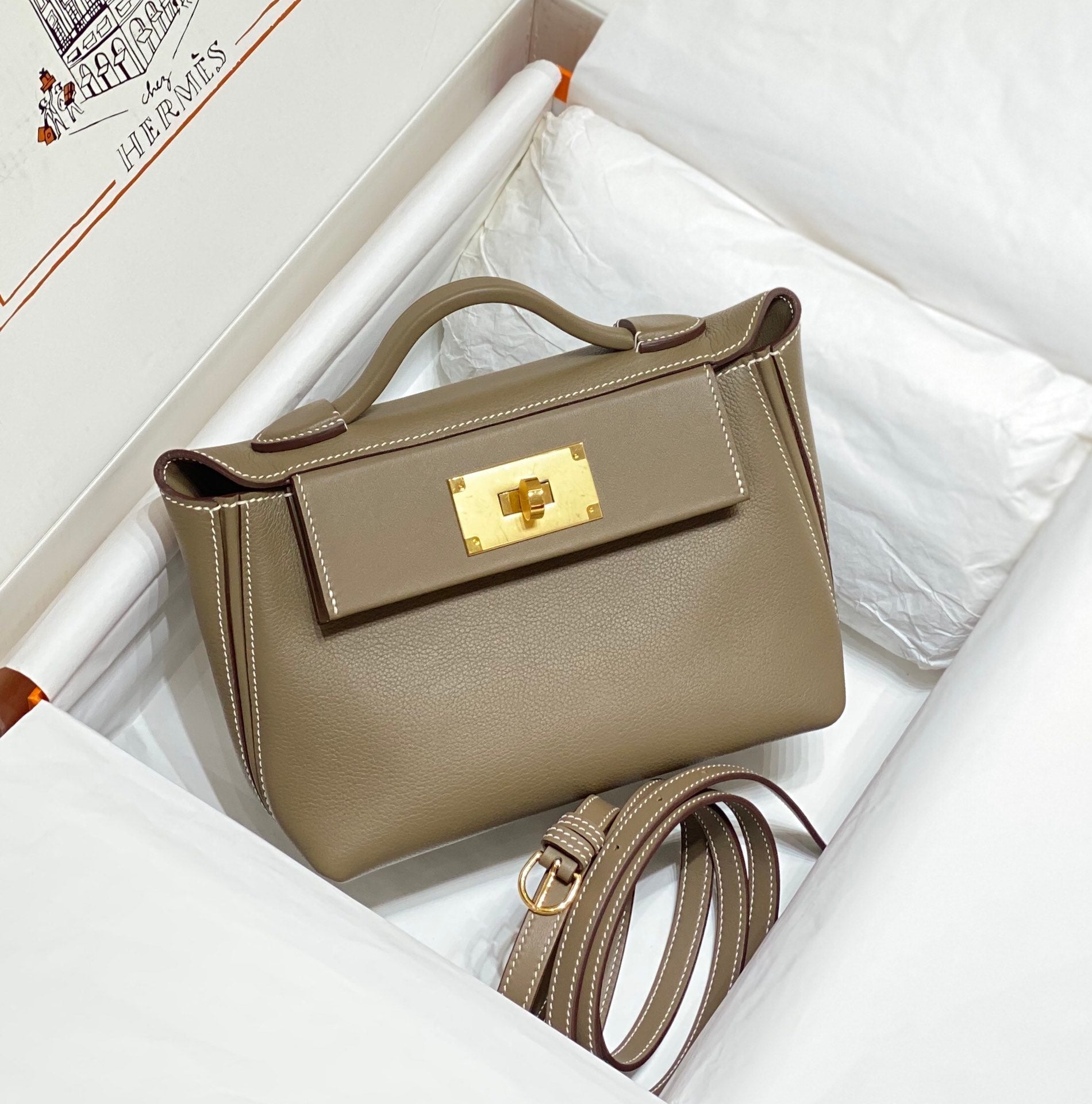 MINI 24/24 21CM IN TOGO ETOUPE EVERCOLOR CALFSKIN GOLD KELLY BUCKLE
