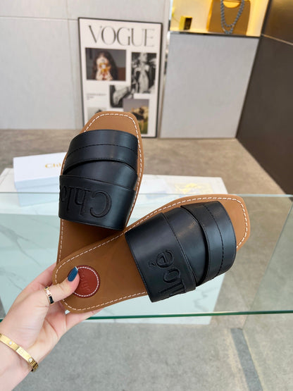 WOODY MULE IN BLACK LAMBSKIN WITH EMBROIDERED LOGO