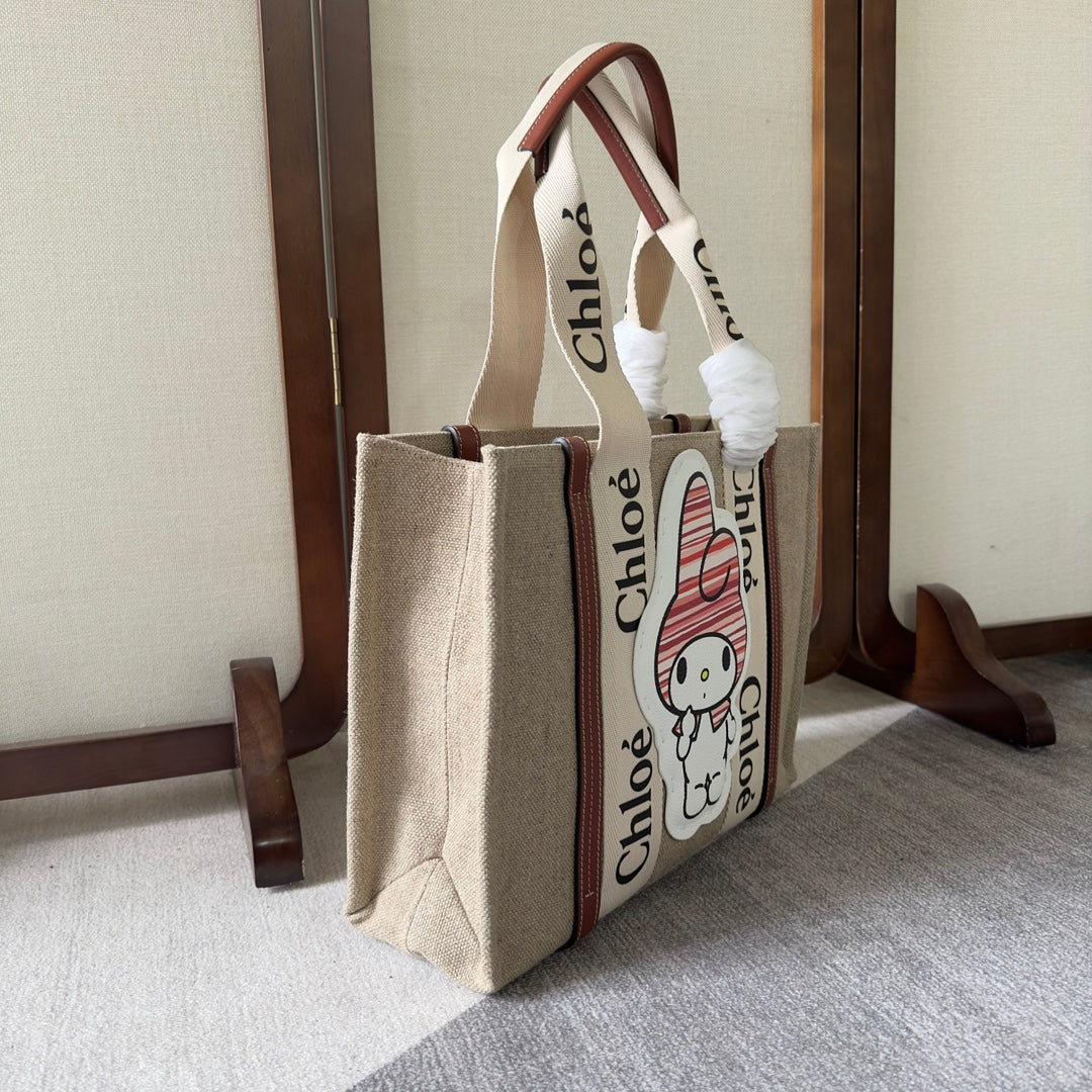 MY MELODY MEDIUM WOODY TOTE BAG 37 IN NATURAL FIBERS BEIGE WEBBING BROWN CALFSKIN