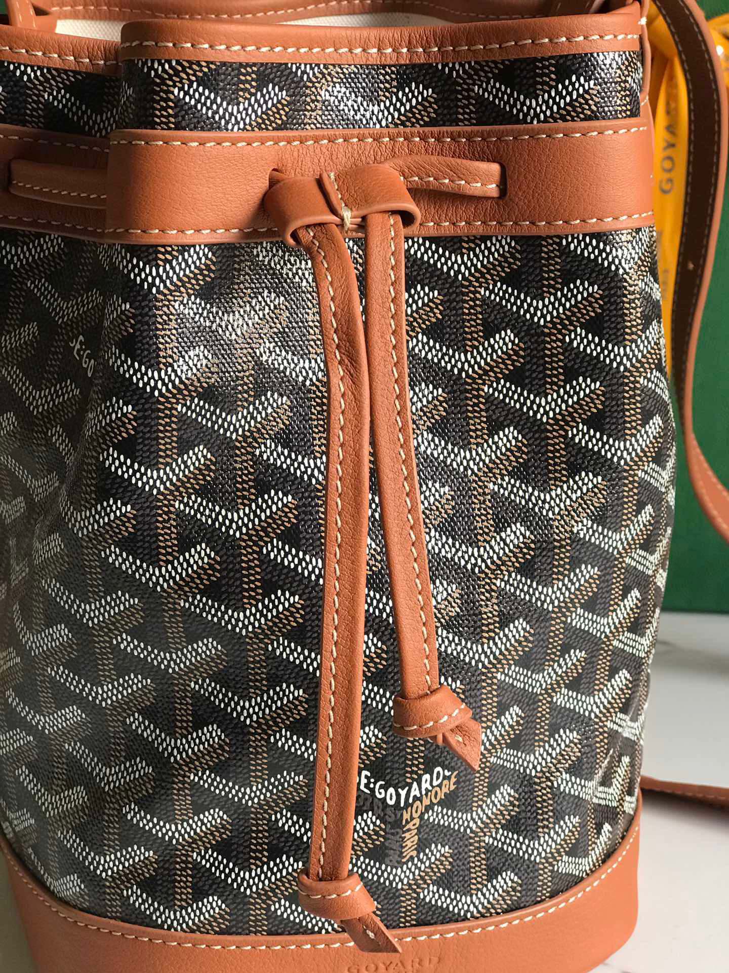 PETIT FLOT BUCKET BAG 22 IN BLACK GOYARDINE CANVAS AND TAN LAMBSKIN TRIM