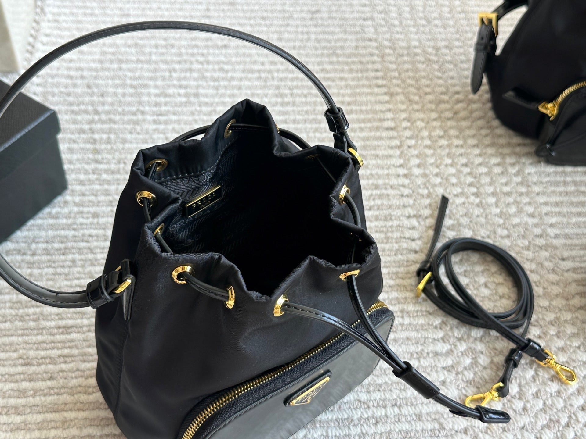 DRAWSTRING HOBO BAG 21 IN BLACK RE-NYLON AND CALFSKIN HANDLE
