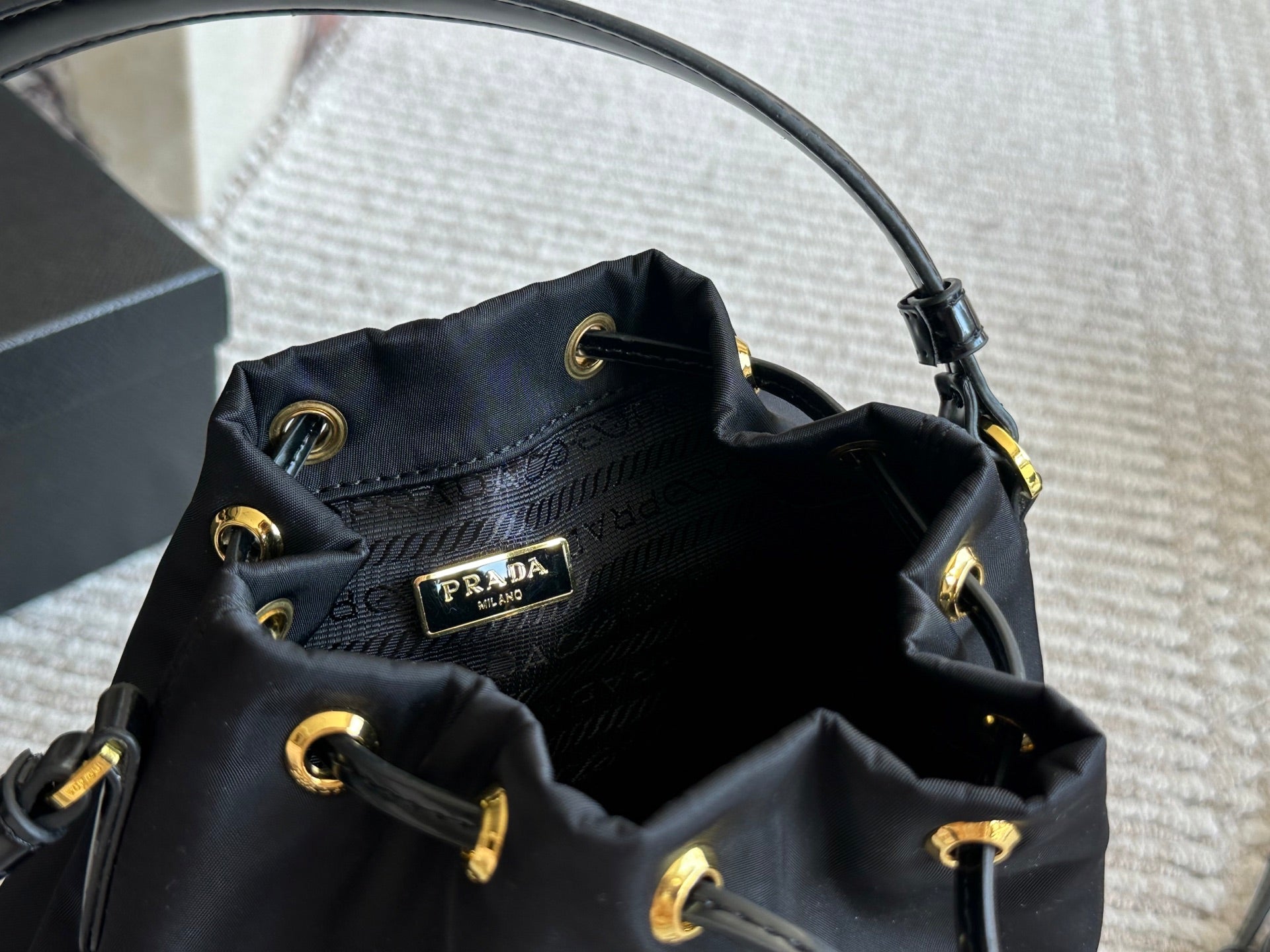 DRAWSTRING HOBO BAG 21 IN BLACK RE-NYLON AND CALFSKIN HANDLE