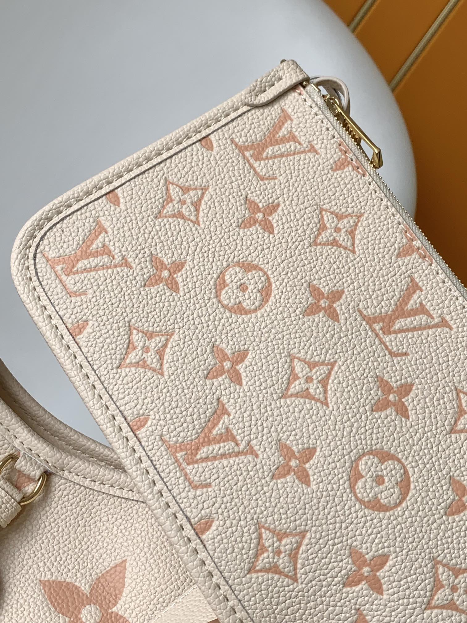 CARRYALL PM 29 BAG IN BEIGE MIX PINK MONOGRAM EMPREINTE LEATHER