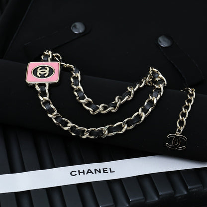 CHAIN CHOKER IN GOLD-PLATED METAL WITH  LEATHER THROUGH LINKS