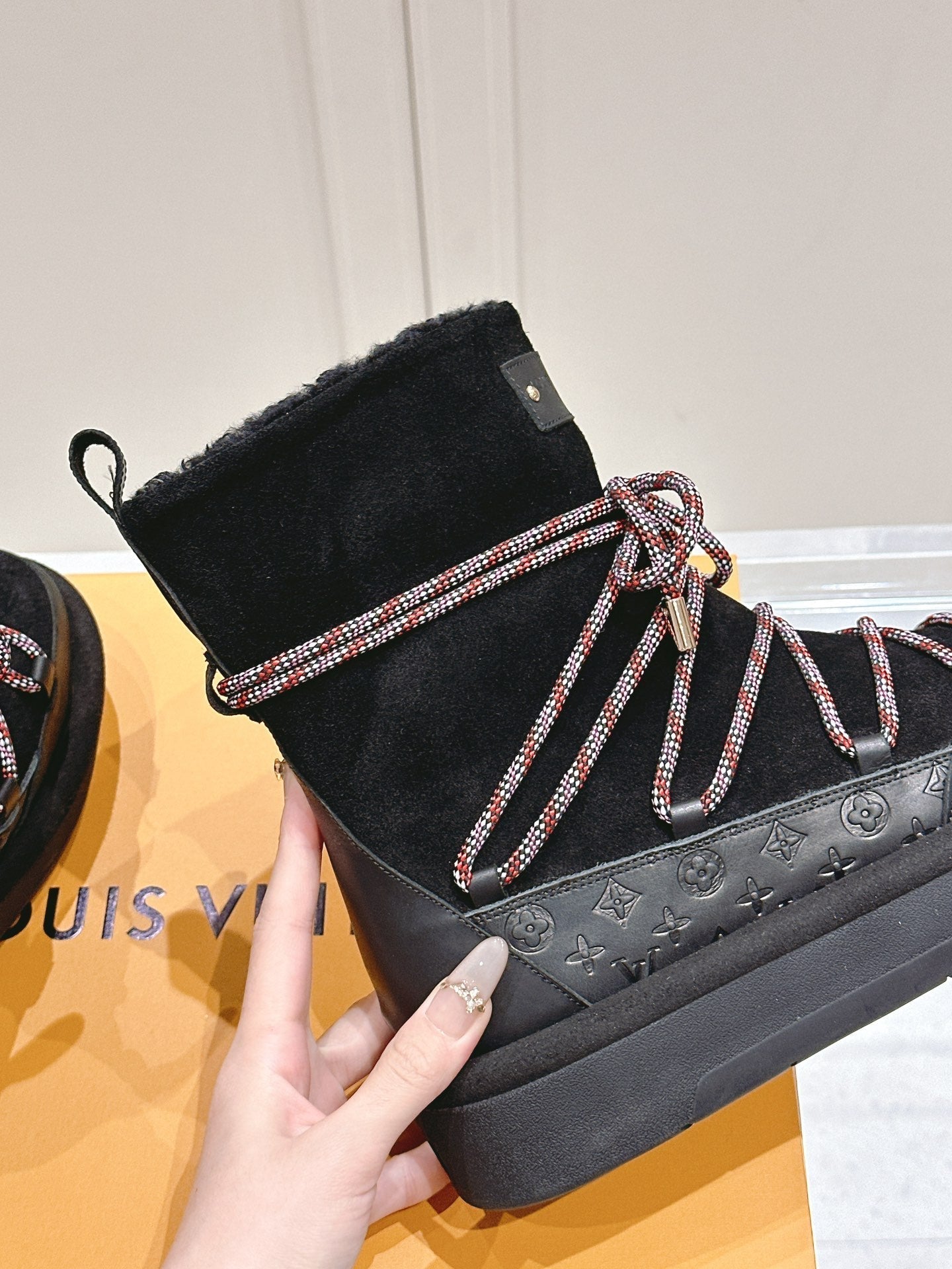 ASPEN PLATFORM ANKLE BOOT IN BLACK MONOGRAM DEBOSSED SUEDE AND SHEARLING