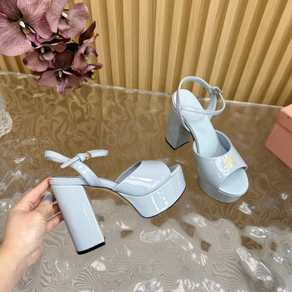 PLATFORM HEELS IN BABY BLUE PATENT CALFSKIN GOLD LOGO IN STRAP