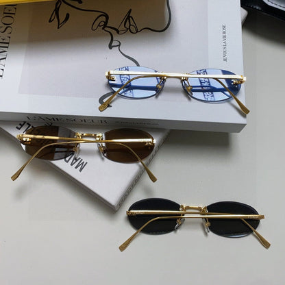 FIRST CRYSTAL RIMLESS OVAL FRAME SUNGLASSES 557152 IN METAL