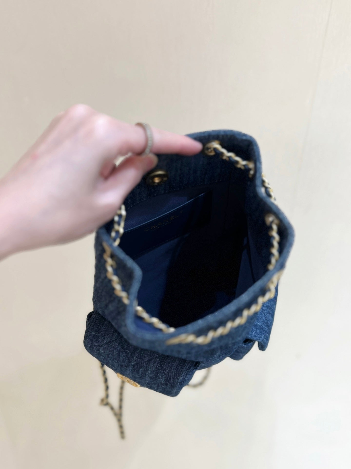 DRAWSTRING BUCKET BACKPACK 24 IN DARK BLUE DENIM GOLD HARDWARE