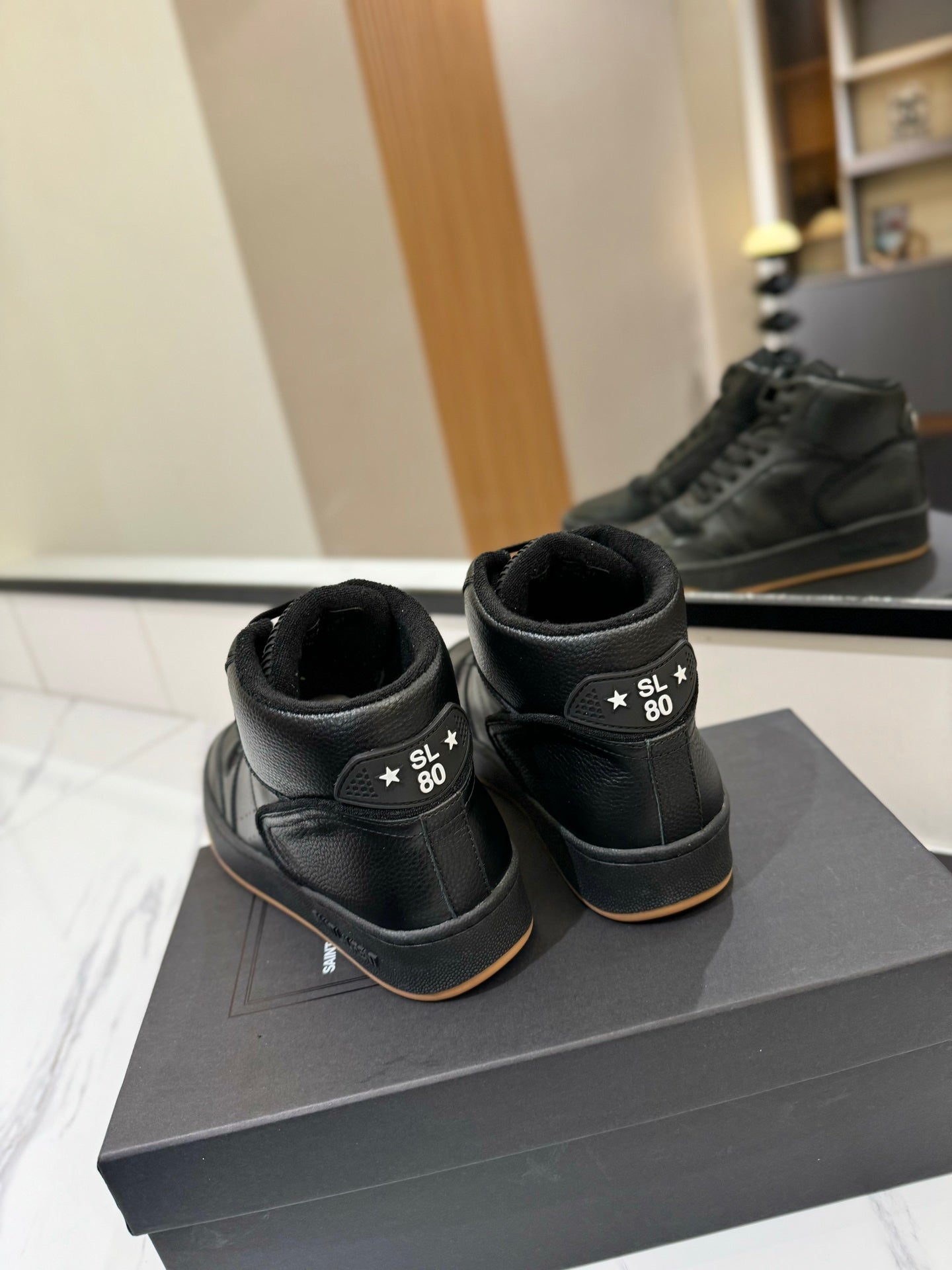 MID-TOP SNEAKERS IN BLACK PERFORATED LAMBSKIN